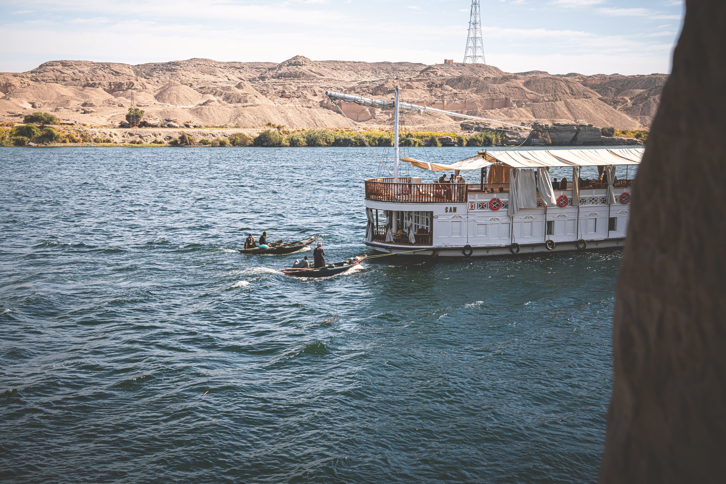 Traditional dahabeya sailing on the Nile at sunset
